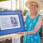 Cim MacDonald holds her certificate recognizing her 20 years of service to Chemainus and the Festival of Murals Society