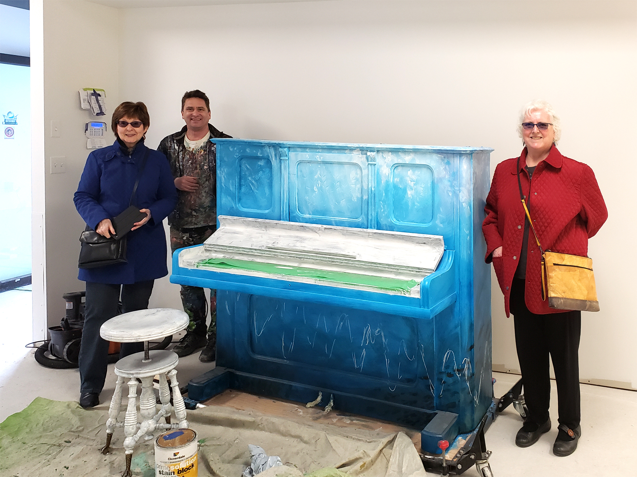 Shannon Bellamy (VP, Festival of Murals Society), Kris Friesen and Peggy Grigor, during construction (Feb. 22, 2020).